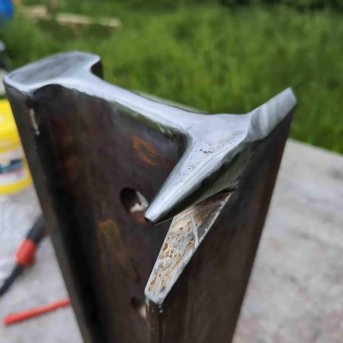 Close up showing the shaped bick and hot cut on a vertical rail anvil.