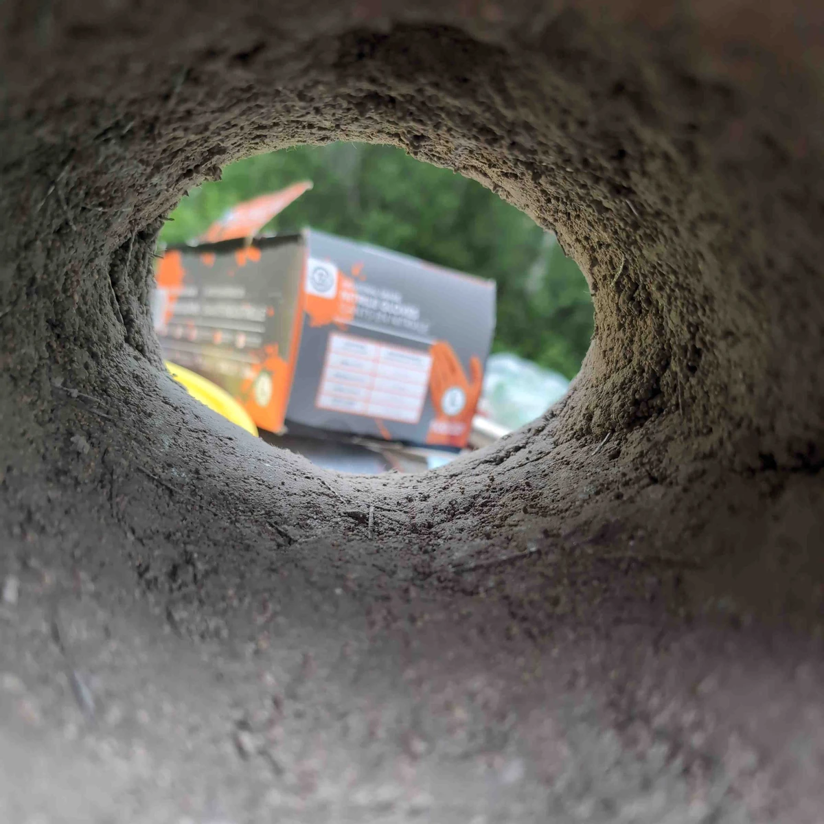 Stainless needles poking thru the first layer of refractory cement.